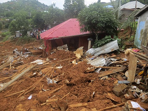 Volunteers search for bodies from the scene of heavy flooding and mudslides in Regent, just outside of Sierra Leone's capital Freetown.(AP)