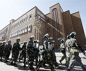 Paramilitary police officers patrol around the Grand Bazaar in Urumqi, western China's Xinjiang province. AP