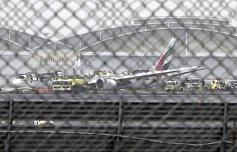 The damaged Boeing 777 is seen at the Dubai airport after it crash-landed in Dubai. (Photo | AP)