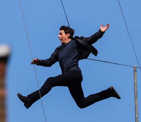 Tom Cruise, in the middle of doing the stunt for Mission Impossible 6 which would injure him seconds later. (Photo | Twitter)