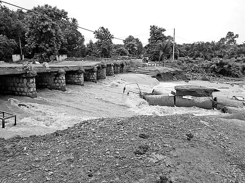 A portion of the temporary bridge washed away by heavy rains near Jagannathpur village in Rayagada | Express