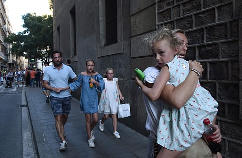 People flee the scene in Barcelona, after the terrorist attack happened on August 17. (Photo | AP)