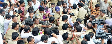 Police arrests Congress leader and former MLA T Jayaprakash Reddy; (below) Supporters of Jayaprakash Reddy stop the police vehicle after his arrest in Sangareddy on Thursday | Express photo