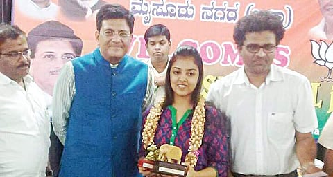 Megha Kochar being felicitated by Union Minister for Power Piyush Goyal in Mysuru on Friday