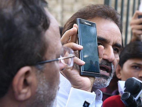 Gujarat Congress MLA Gohil, addressing the media outside the resort following the I-T raids on Wednesday. (Vinod Kumar T)