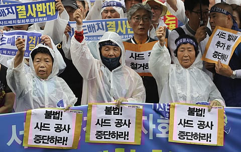 South Korean protesters and residents attend a rally against the deployment of an advanced U.S. missile defense system THAAD, near the presidential Blue House in Seoul. (AP)