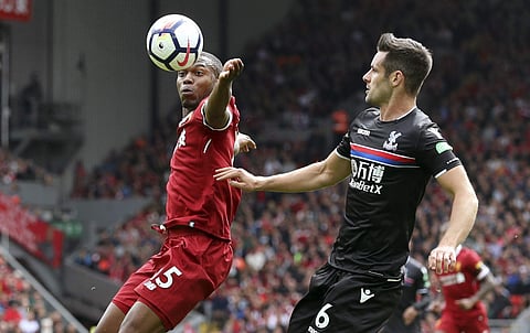 Liverpool's Daniel Sturridge, left, and Crystal Palace's Scott Dann battle for the ball, during the English Premier League soccer match between Liverpool and Crystal Palace. (Photo | AP)
