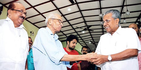 Chief Minister Pinarayi Vijayan greets litterateur M K Sanu at the Yukthivadi M C Joseph Award presentation function in Kochi on Saturday | K Shijith