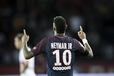 PSG's Neymar celebrates after scoring against Toulouse during the French League One soccer match between PSG and Toulouse at the Parc des Princes stadium in Paris. | AP