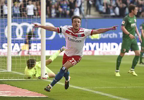 Hamburg's Nicolai Mueller celebrates his goal during the the German Bundesliga soccer match between Hamburger SV and FC Augsburg in Hamburg, Germany, Saturday, Aug. 19, 2017. (Photo| AP)