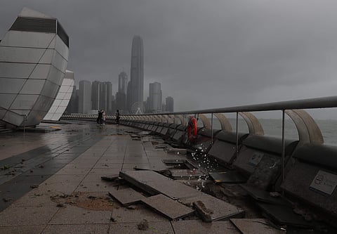 Debris caused by Typhoon Hato damage is strewn across the waterfront of Victoria Habour in Hong Kong, Wednesday, Aug. 23, 2017. | AP