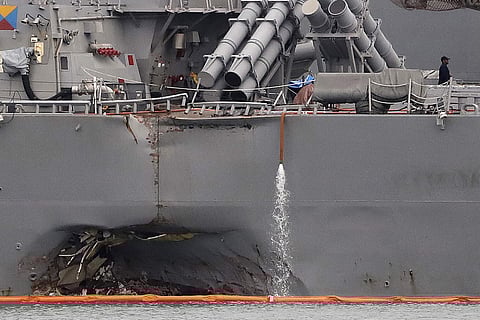 The damaged port aft hull of the USS John S. McCain (AP)