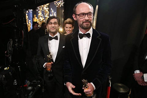 Asif Kapadia, left, and James Gay-Rees appearbackstage at the Oscars on Sunday, Feb. 28, 2016, at the Dolby Theatre in Los Angeles. | AP