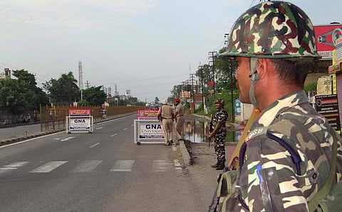 Security personnel keep vigil on a highway in Jalandhar on Friday following Dera Sacha Sauda chief Gurmeet Ram Rahim s conviction on Friday. (PTI)