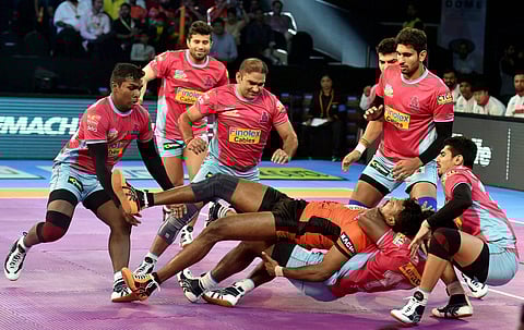 U Mumba (orange) and Jaipur Pink Panthers (Pink) players in action during their Pro Kabaddi League match in Mumbai. | PTI