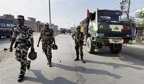 Army personnel take positions after deployment near Dera Sacha Sauda in Sirsa on Saturday following violence triggered by the conviction of Dera Sacha Sauda head Gurmeet Ram Rahim Singh in a rape case. | PTI