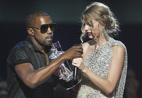 When it all started: Kanye West takes the microphone from singer Taylor Swift as she accepts the Best Female Video award during the 2009 MTV Video Music Award. (File | Associated Press)