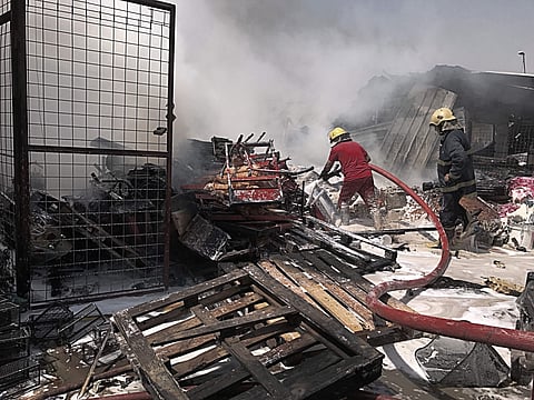 Iraqi firefighters work at the scene of a car bomb explosion in the wholesale Jamila market in Baghdad's Shiite district of Sadr City, Iraq, Monday, Aug. 28, 2017. A car bomb ripped through a busy market area in eastern Baghdad on Monday morning, killing