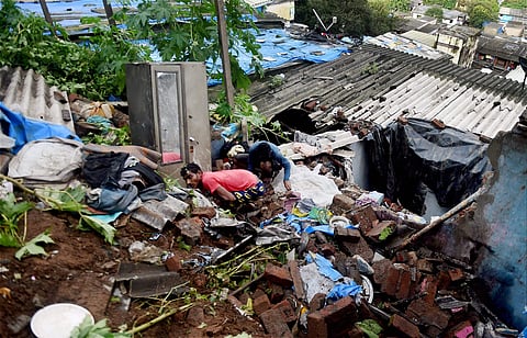 Debris of the collapsed houses after a landslide in Vikroli Mumbai on Wednesday. One person was killed in the mishap. | PTI