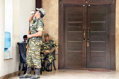 CRPF personnel stand guard outside Energy Minister D K Shivakumar’s residence in Sadashivanagar in Bengaluru during the I-T raids, on Thursday | Pushkar V