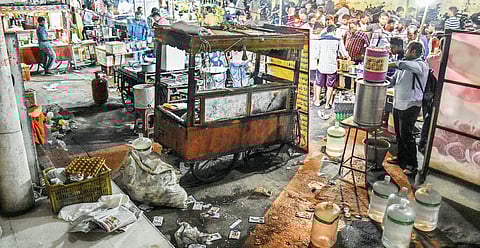 Garbage piled up near a stall at a food Court in IGMC stadium in Vijayawada on Wednesday | p ravindra babu