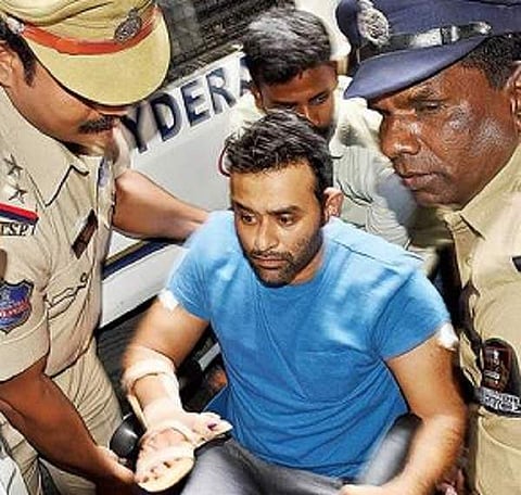 Police taking Vikram Goud into custody after he was discharged from hospital in Hyderabad on Thursday | Express PHOTO