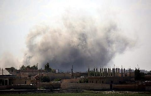Smoke billows in the Syrian city of Raqqa's eastern al-Sinaa district, on June 21, 2017, during an offensive by US-backed fighters. (File Photo | AFP)