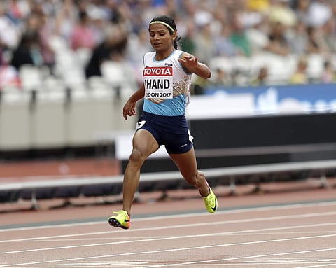 Dutee Chand crosses the line a women's 100m heat during the World Athletics Championships in London. | AP