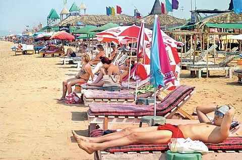 Russian charter tourists on the beach at Candolim
