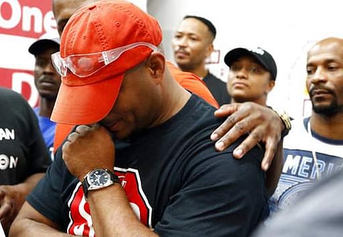Nissan employee Morris Mock is consoled as he and other pro-union Nissan employees express their disappointment at losing their bid to form a union at the Nissan vehicle assembly plant in Canton, Mississipi on August 4. (Photo | AP)