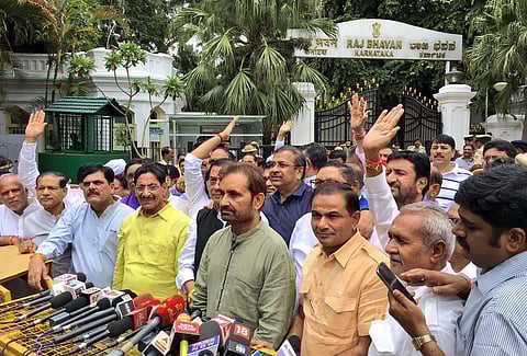 Gujarat MLAs address the media after meeting Karnataka governor Vajubhai Vala outside Raj Bhavan in Bengaluru. (EPS | Pushkar V)
