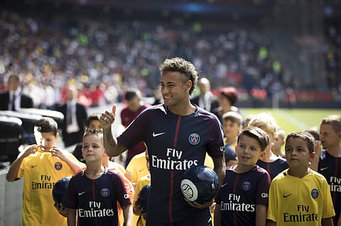 Brazilian soccer star Neymar waves to fans at the Parc des Princes stadium in Paris, Saturday, Aug. 5, 2017, during his official presentation ahead of Paris Saint-Germain's season opening match against Amiens. | AP