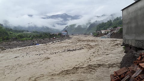 Flood water rages in a river in northern province of Son La, Vietnam on Thursday Aug. 3, 2017. Flash floods triggered by heavy rains have killed seven people and left 27 others missing in three northern provinces. | AP