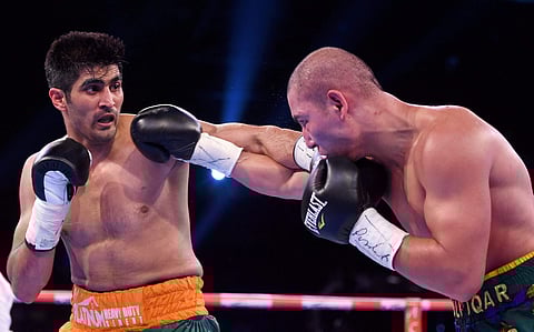 Vijender Singh in action against the Chinese boxer Zulpilkar Maimaitiali. | PTI