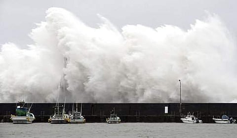 Waves crush a fishing port in Aki, Kochi prefecture on Shikoku island, southern Japan due to a strong typhoon (AP)