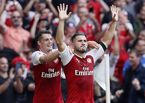 Arsenal's Sead Kolasinac, right, celebrates scoring his sides first goal during the English Community Shield soccer match between Arsenal and Chelsea at Wembley Stadium in London. | AP