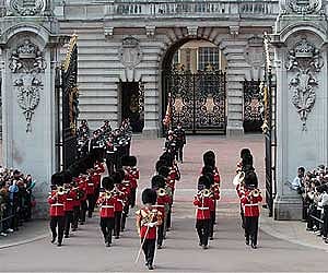 A British army band marches for the Changing of the Guard outside Buckingham Palace, in central London. AP File Photo