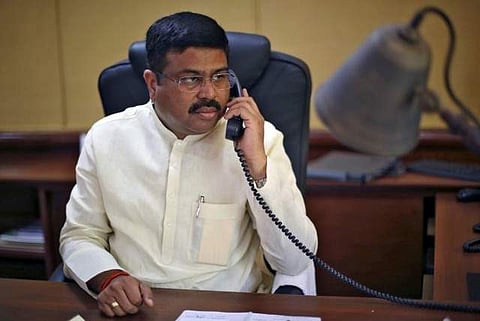 Oil Minister Dharmendra Pradhan speaks on phone during an interview with Reuters in New Delhi, India, May 5, 2016. (Picture: Reuters)