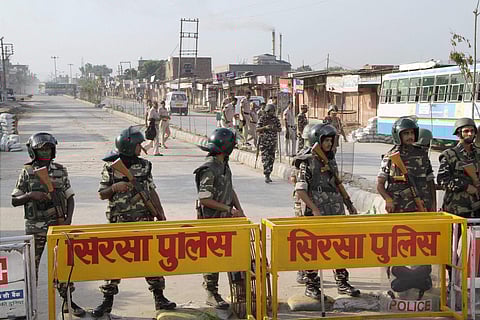 Sirsa Security jawans stand gaurd near the Dera Sacha Sauda in Sirsa.| PTI