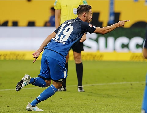 Hoffenheim's Mark Uth celebrates his side's second goal against Bayern Munich (AP)