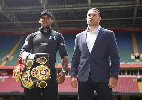 British boxer Anthony Joshua, left and Bulgarian boxer Kubrat Pulev pose for a photo during the press conference at the Principality Stadium, Cardiff. | AP