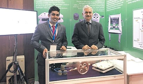 Gautham Jayashanker (L), CEO, Olive Energy with the cooking unit at an expo