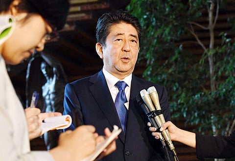 Japan's Prime Minister Shinzo Abe speaks to reporters at his official residence in Tokyo following North Korea's missile launch. | AP