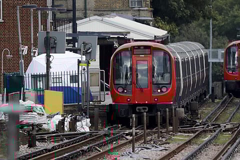 A police forensic tent stands setup on the platform next to the train on which a homemade bomb exploded at Parsons Green subway station in London (AP)