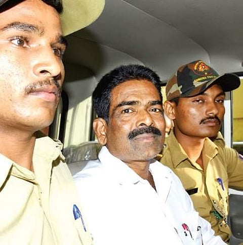 Serial killer Cyanide Mohan who is accused of murdering 20 women, being escorted at Court premises on Friday | Rajesh Shetty Ballalbagh