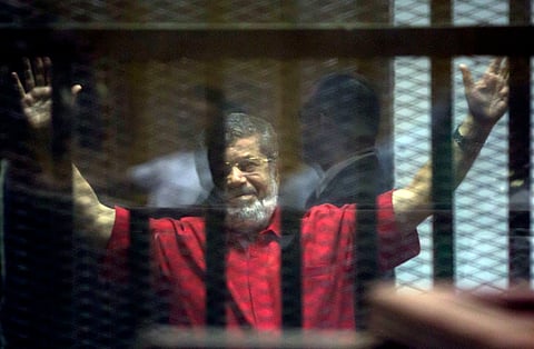 Former Egyptian President Mohammed Morsi inside a defendants cage (File | AP)