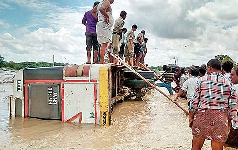 The APSRTC bus, which was trapped 10 feet under water, in the Paleru Vagu in Kurnool district after heavy rains on Saturday | Express