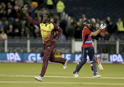 West Indies Carlos Brathwaite celebrates after taking the wicket of England's Liam Plunkett to win the T20 match at the Emirates Riverside stadium in Durham, England. | AP