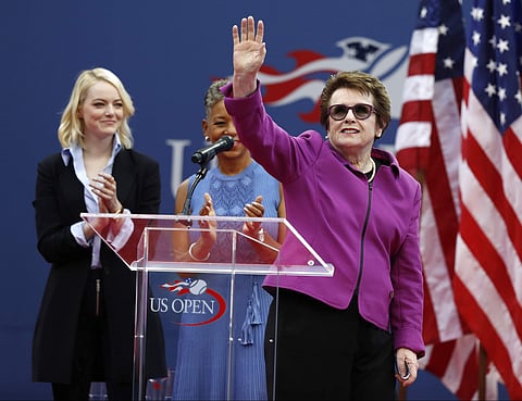 Billie Jean King, right, waves to spectators during the opening ceremony for the women's singles final of the U.S. Open tennis tournament, Saturday, Sept. 9, 2017, in New York. Actress Emma Stone, left, and USTA CEO Katrina Adams, looked on. | AP