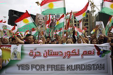 Kurds wave Kurdish flags during a rally to support an independence referendum in Iraq, at Martyrs Square in Downtown Beirut.(Photo | AP)
